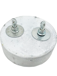 Top of a White 10 Pound Lead Karting Weight.