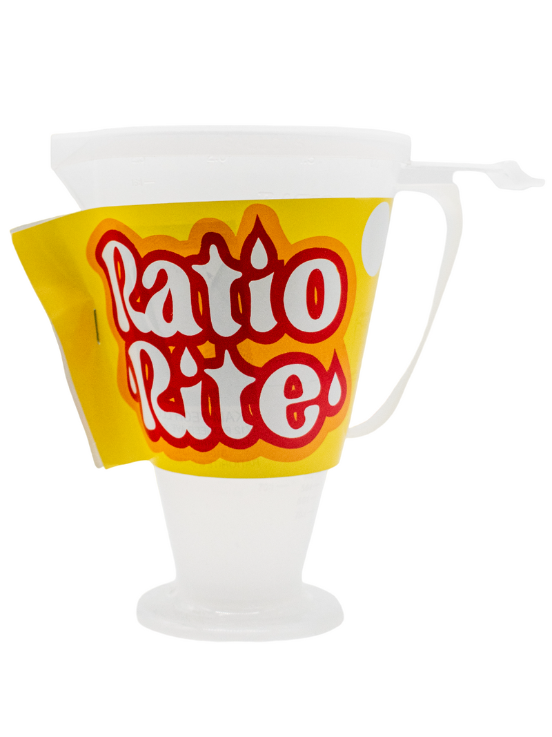 Front of a Ratio Rite Oil Measuring Cup with Lid and Yellow, Orange, White, and Red Ratio Rite Label.