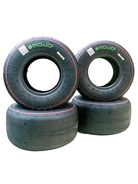 Full Set of Four Mojo D2xx 4.5/10-5 Tires. Two are Standing Upright and are Stacked on the Other Two Tires Laying Down. These Tires are sized for Cadet Karts.