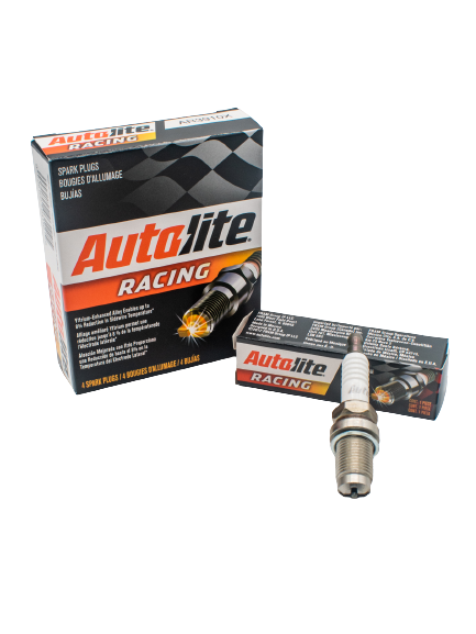 Autolite AR3910X Spark Plug 4 Box Pack with a Single Spark Plug Laying on its Single Box to the Right of It.