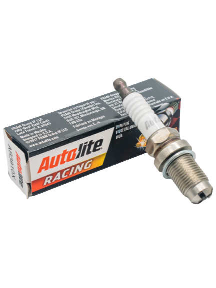 Front Left View of an Autolite AR3910X Spark Plug Laying on its Box.